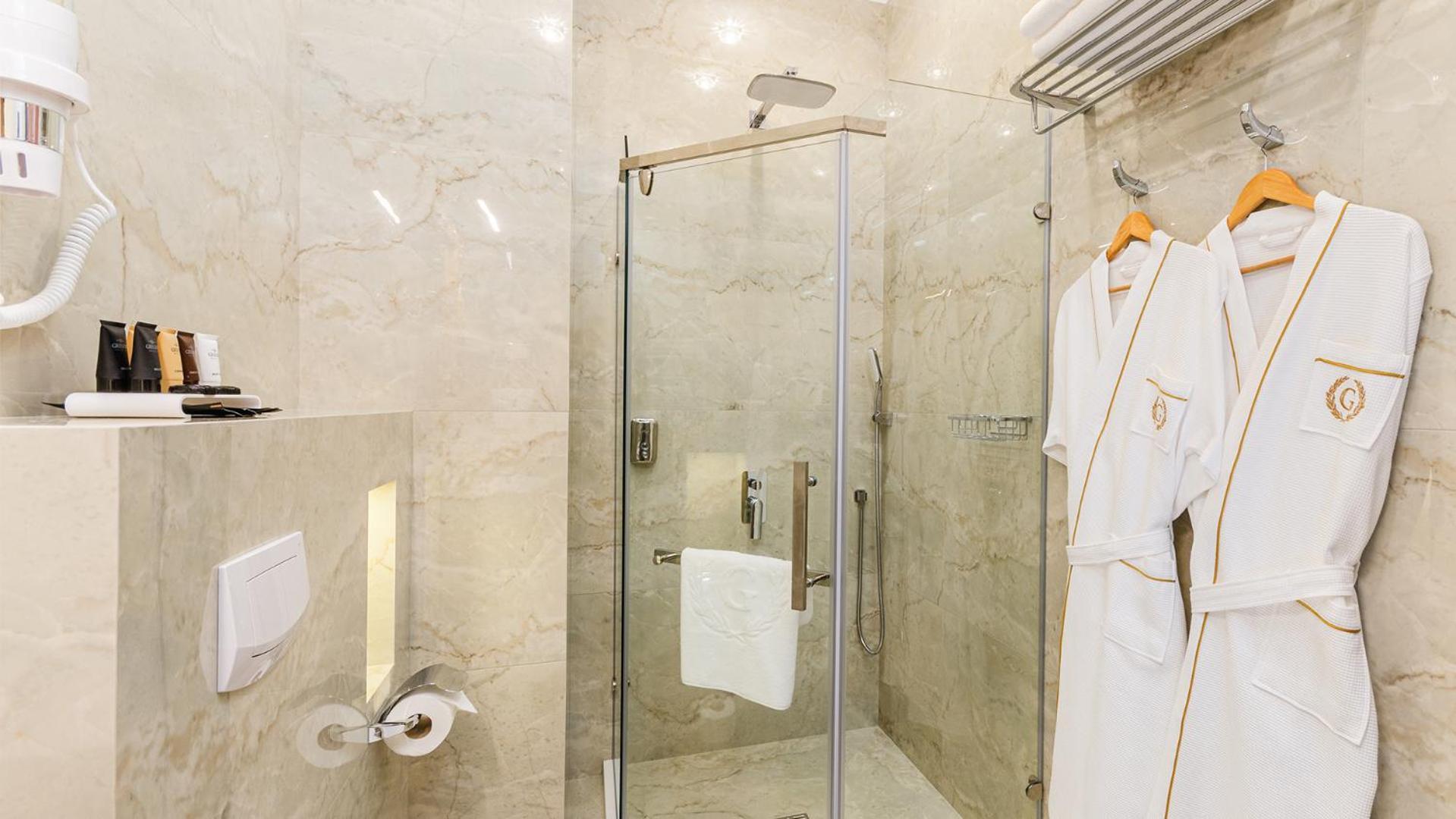 Gregory Boutique Hotel Chişinau Exteriör bild A shower with a sliding door